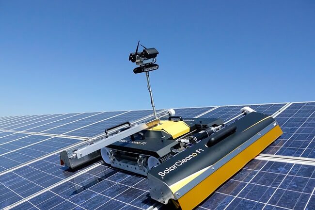 Solar panels being cleaned by robot